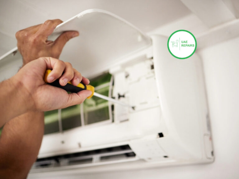 Emergency AC repair technician fixing unit in Dubai home