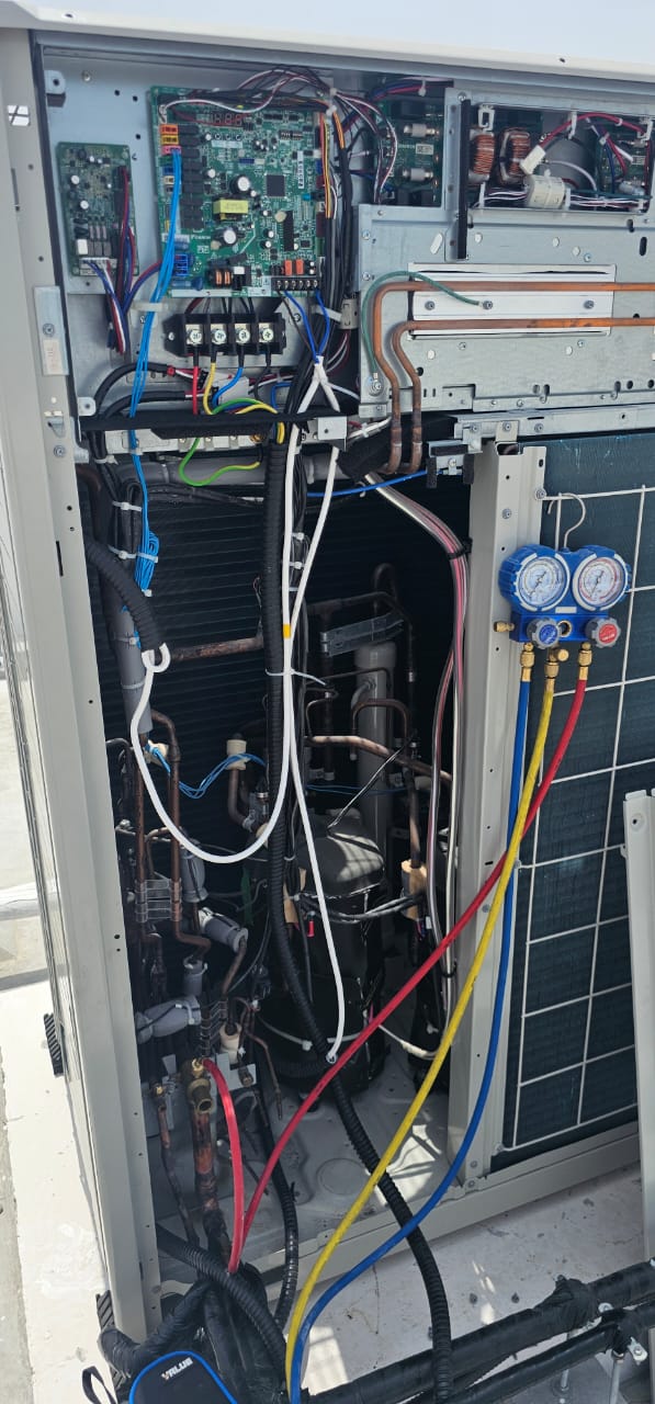Plumber replacing high-rise water pressure pump in Dubai
